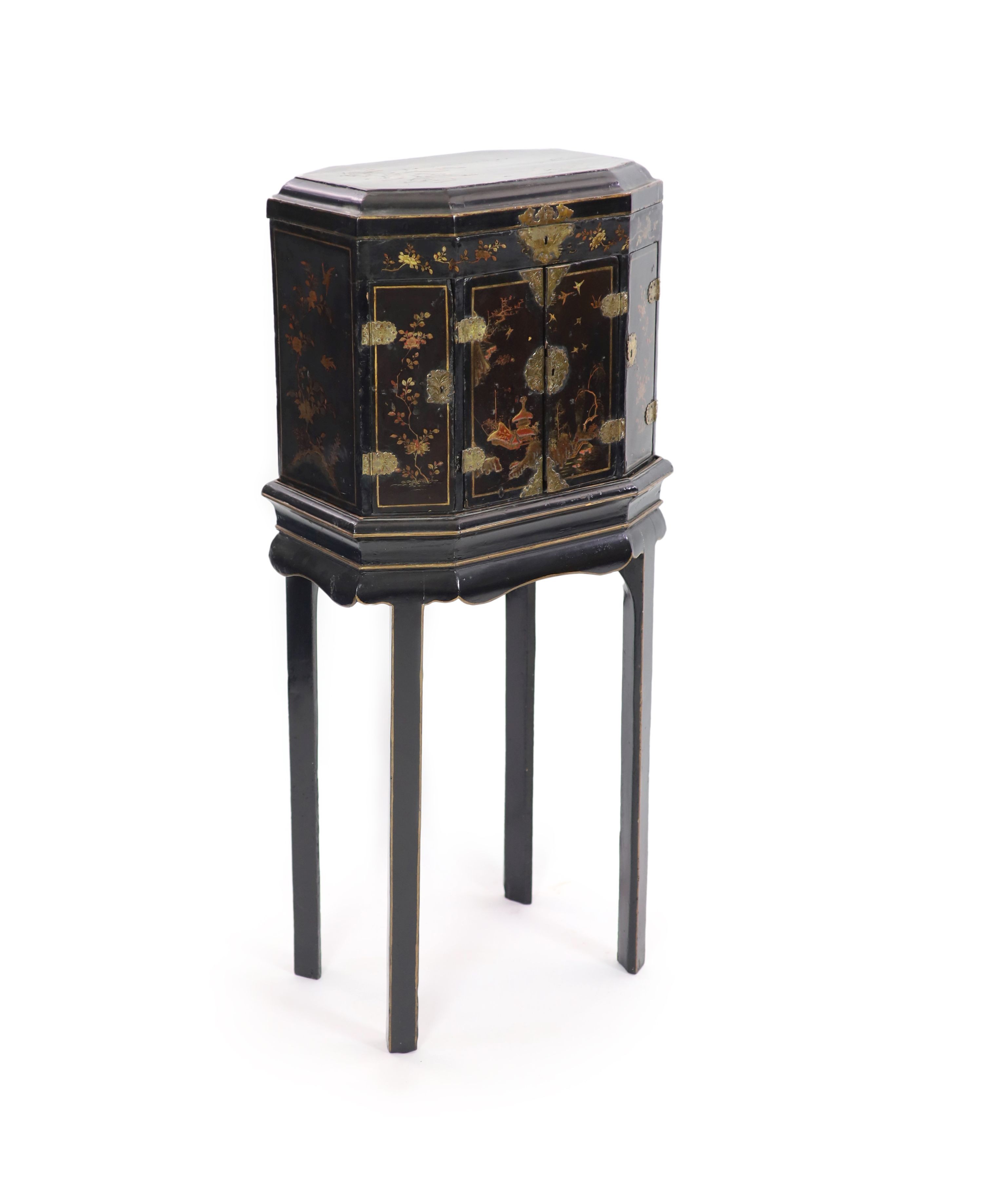 An 18th century Japanese black lacquered table cabinet on stand H 123cm. W 56cm. D 38cm.